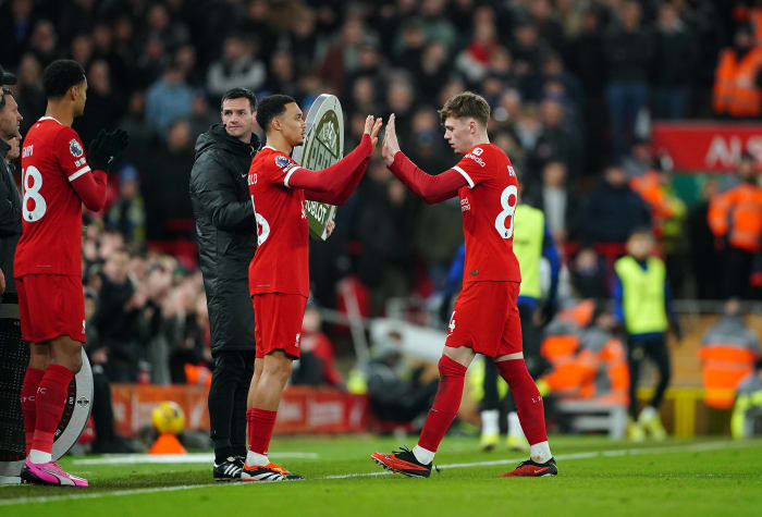 Conor Bradley pictured (right) being substituted off for Liverpool teammate Trent Alexander-Arnold during a 4-1 win over Chelsea in January 2024